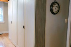 A pair of medium-duty Barnfold doors cover a laundy closet.
