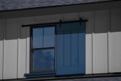 6004ES4-exterior-dummy-hardware-single-shutter-on-gray-house-with-blue-shutter
